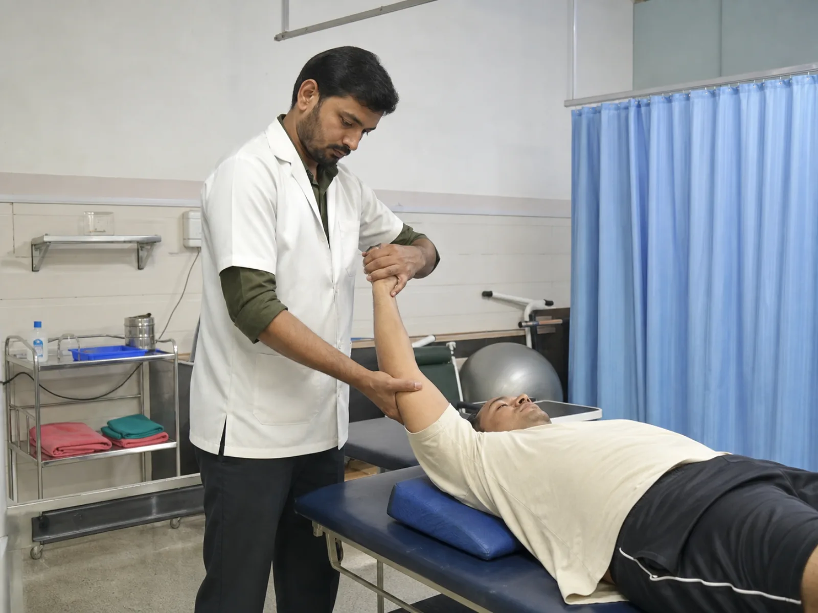 Physiotherapist providing hands-on shoulder mobilisation